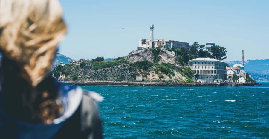 From San Francisco: Alcatraz Night and Yosemite Day Tour - Boat narration, docking, and the cellhouse tour flow